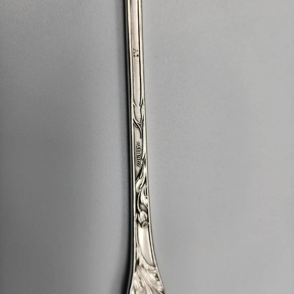 Silver serving fork by R. Wallace 1835 A1 Blossom pattern 8.75